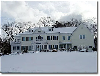 Completed residential electrical project, colonial home exterior in winter