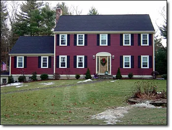 Completed residential electrical project, red colonial home exterior
